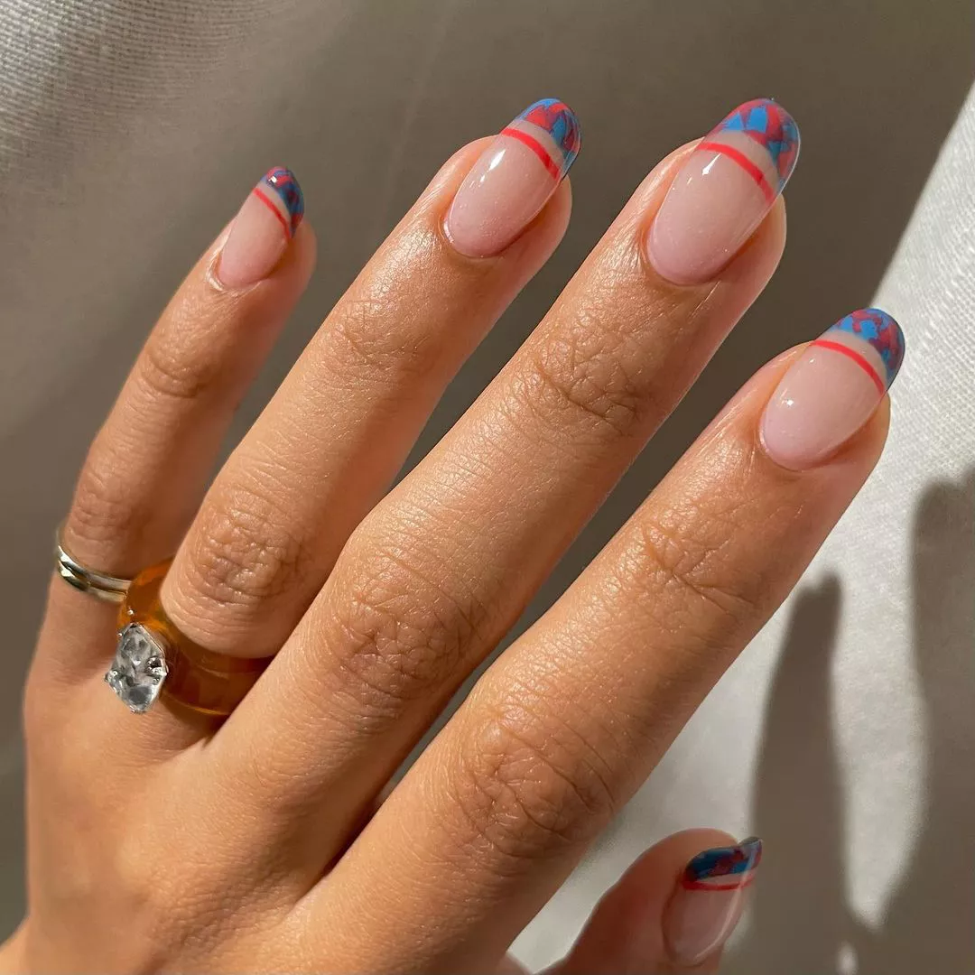 Double French manicure with abstract blue and red tips