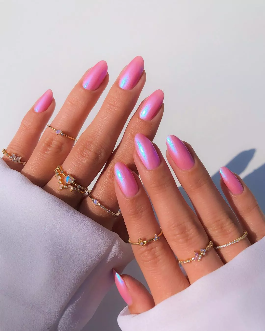Iridescent bubblegum pink nails.