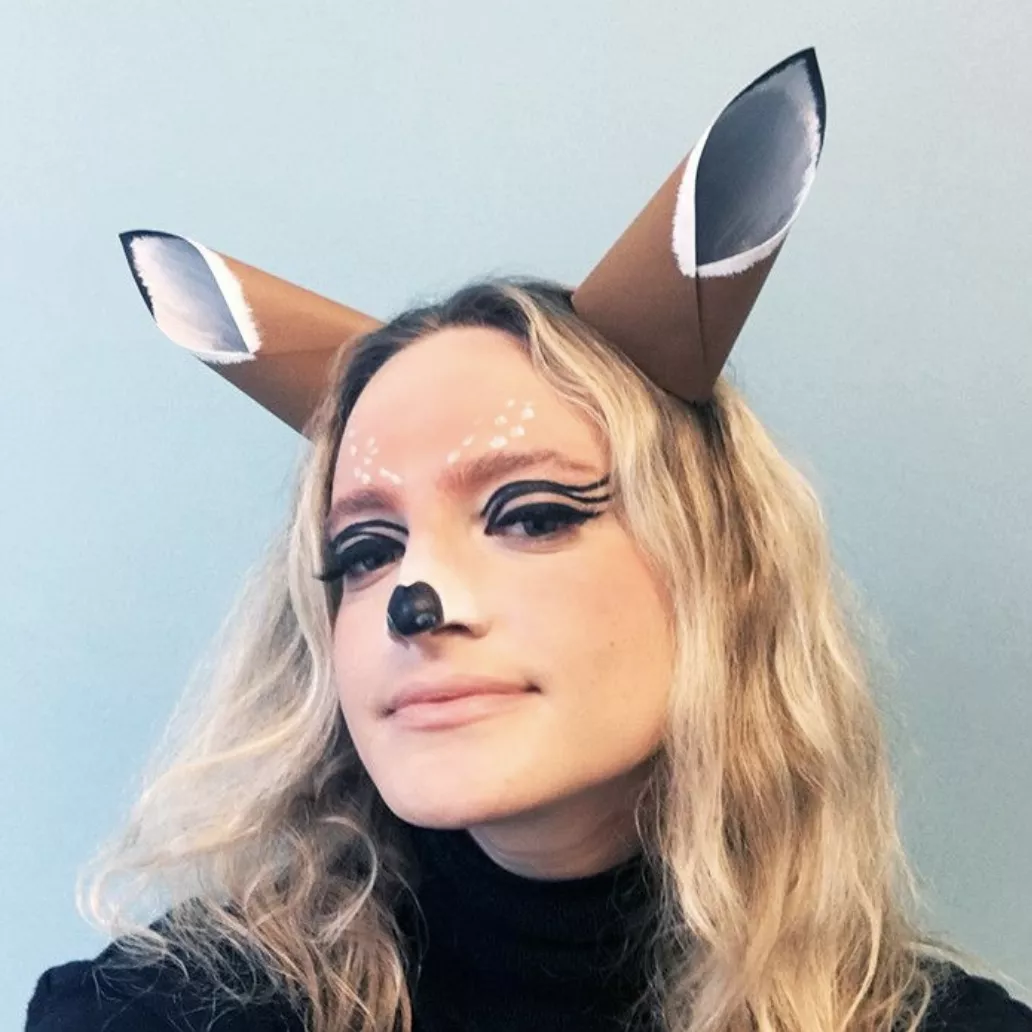 Woman with deer makeup look and paper ears