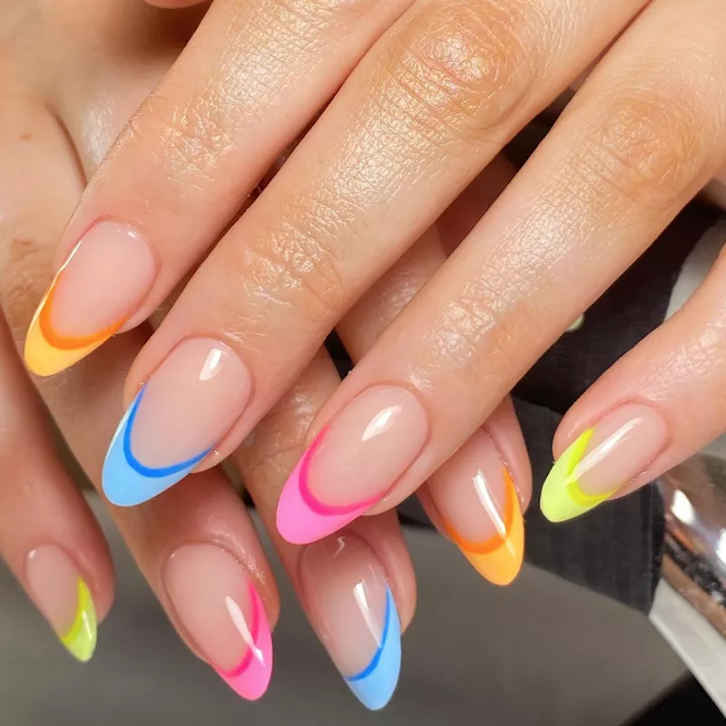 Double French manicure with yellow, orange, pink, and blue neon tips