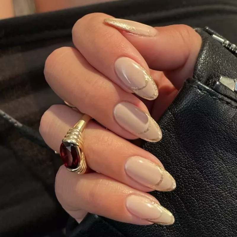 Neutral manicure with metallic double French tip design