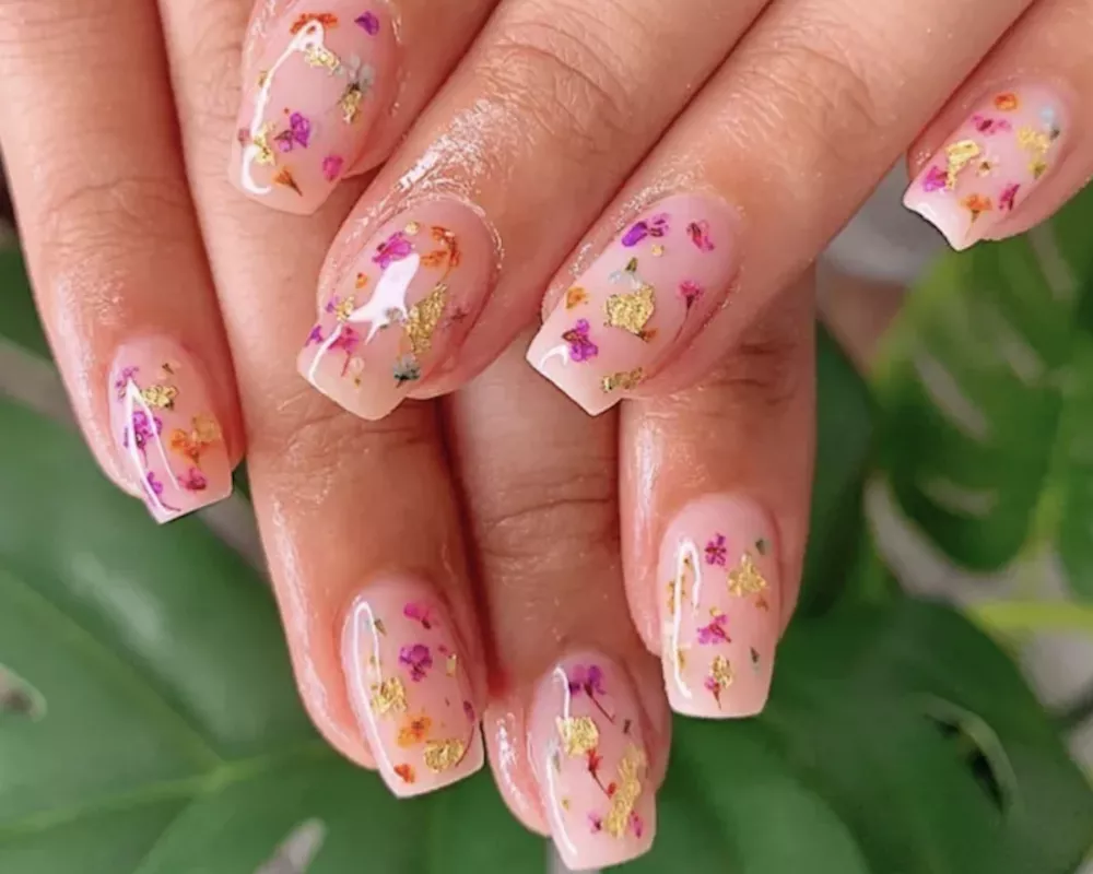Milk bath nails with pink and purple flowers and gold foil accents