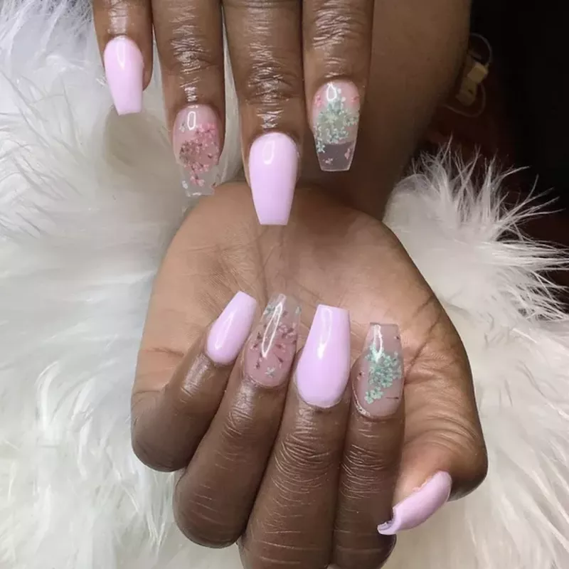 Milk bath manicure with pink and light blue accent flowers