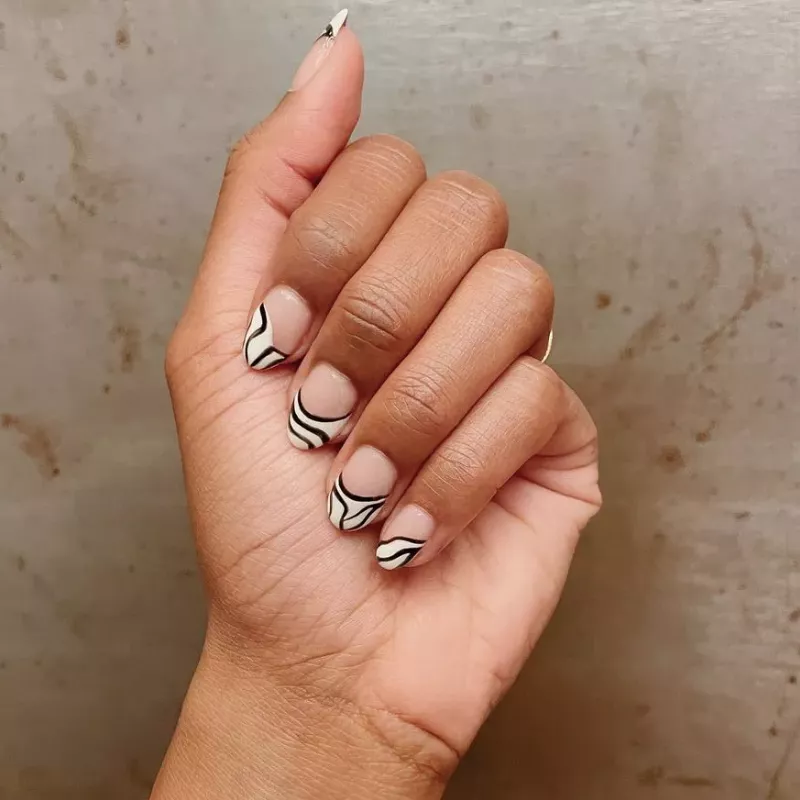 French manicure with zebra print tips