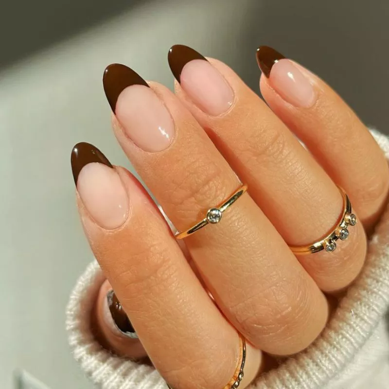 Classic French manicure with a brown tip