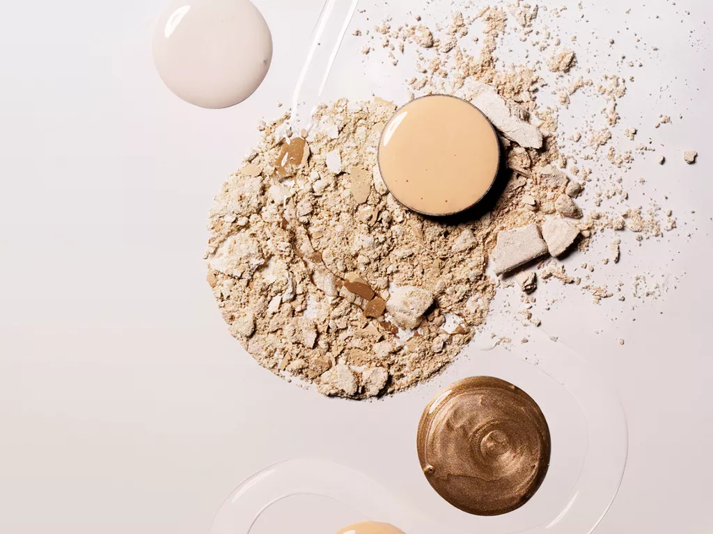 Crushed powder and pools of liquid foundation and bronzer.