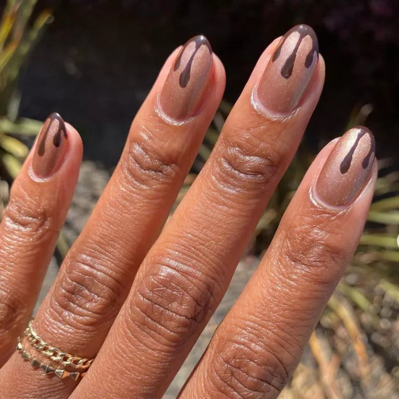Sparkly nails with brown dripping tips