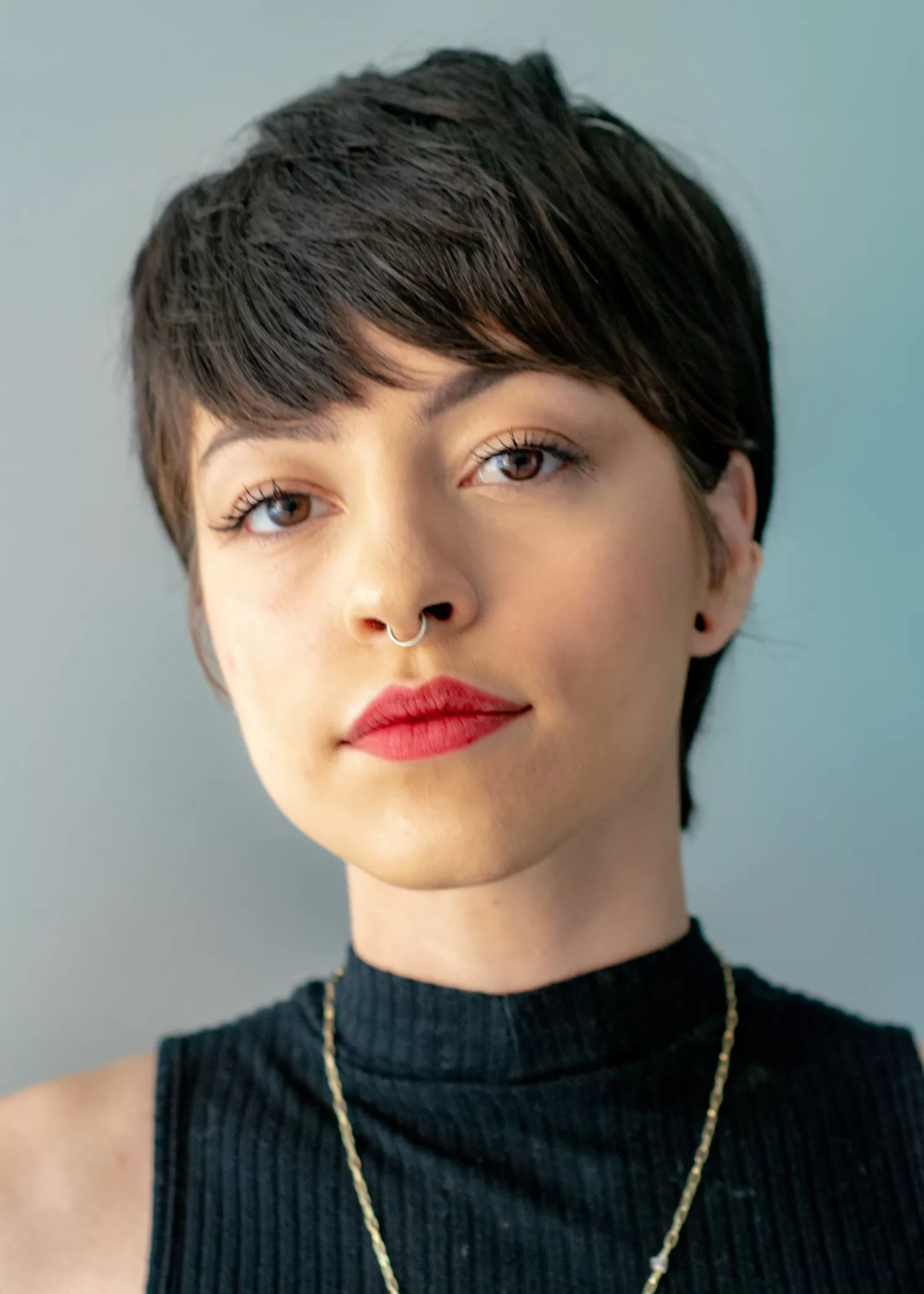 woman with short hair and septum piercing