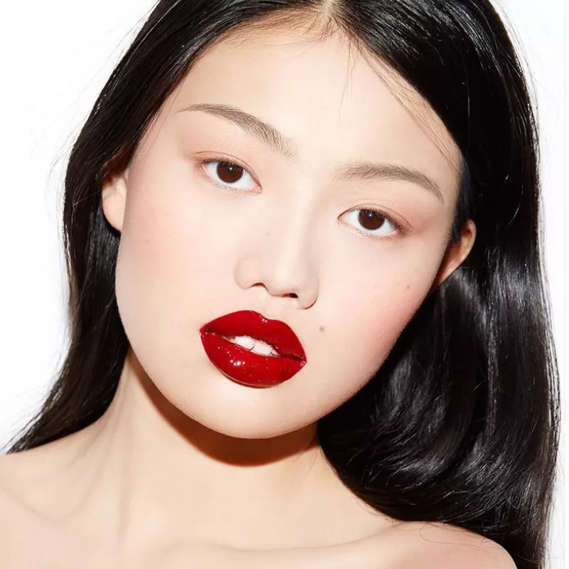 model with matte skin and red lips