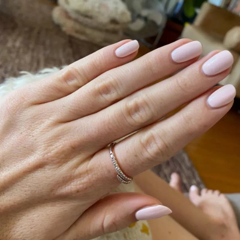 Classic nude pink nails painted using the Italian manicure technique