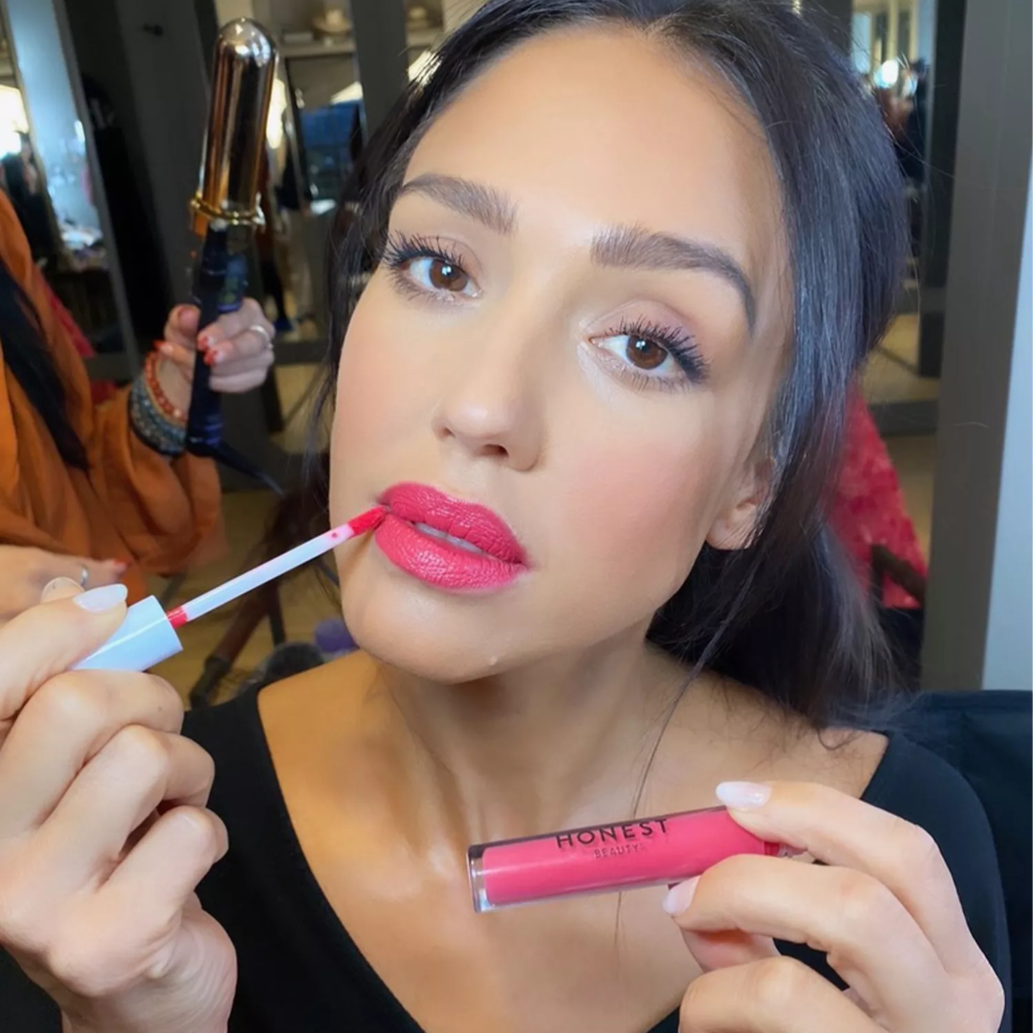 Jessica Alba applying lipstick