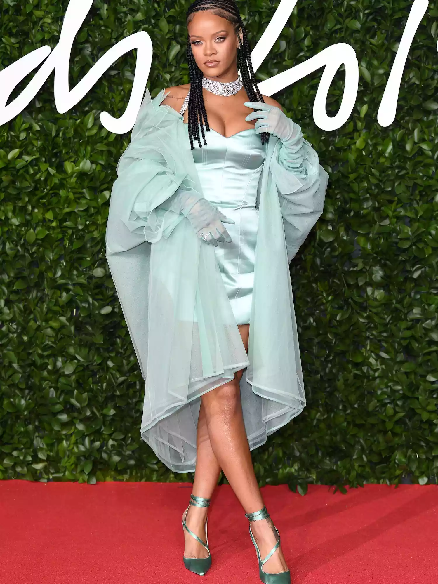 Rihanna wears a mint minidress and coat set by Fenty to the 2019 Fashion Awards in London