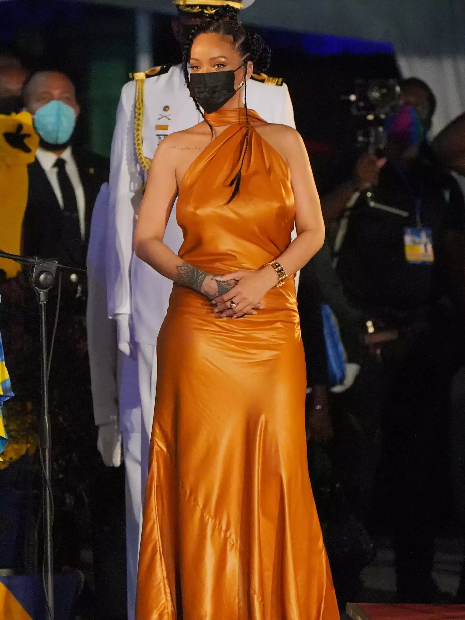 Rihanna wears a one-shoulder orange Bottega Veneta gown to the Barbados presidential inauguration ceremony in 2021