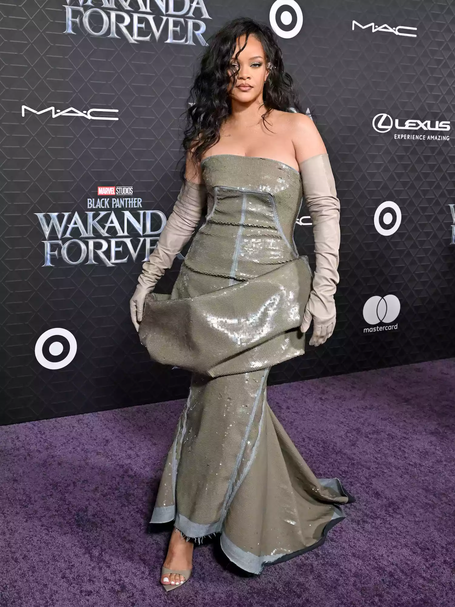 Rihanna wears a sequined Rick Owens gown and beige gloves to the Black Panther: Wakanda Forever premiere