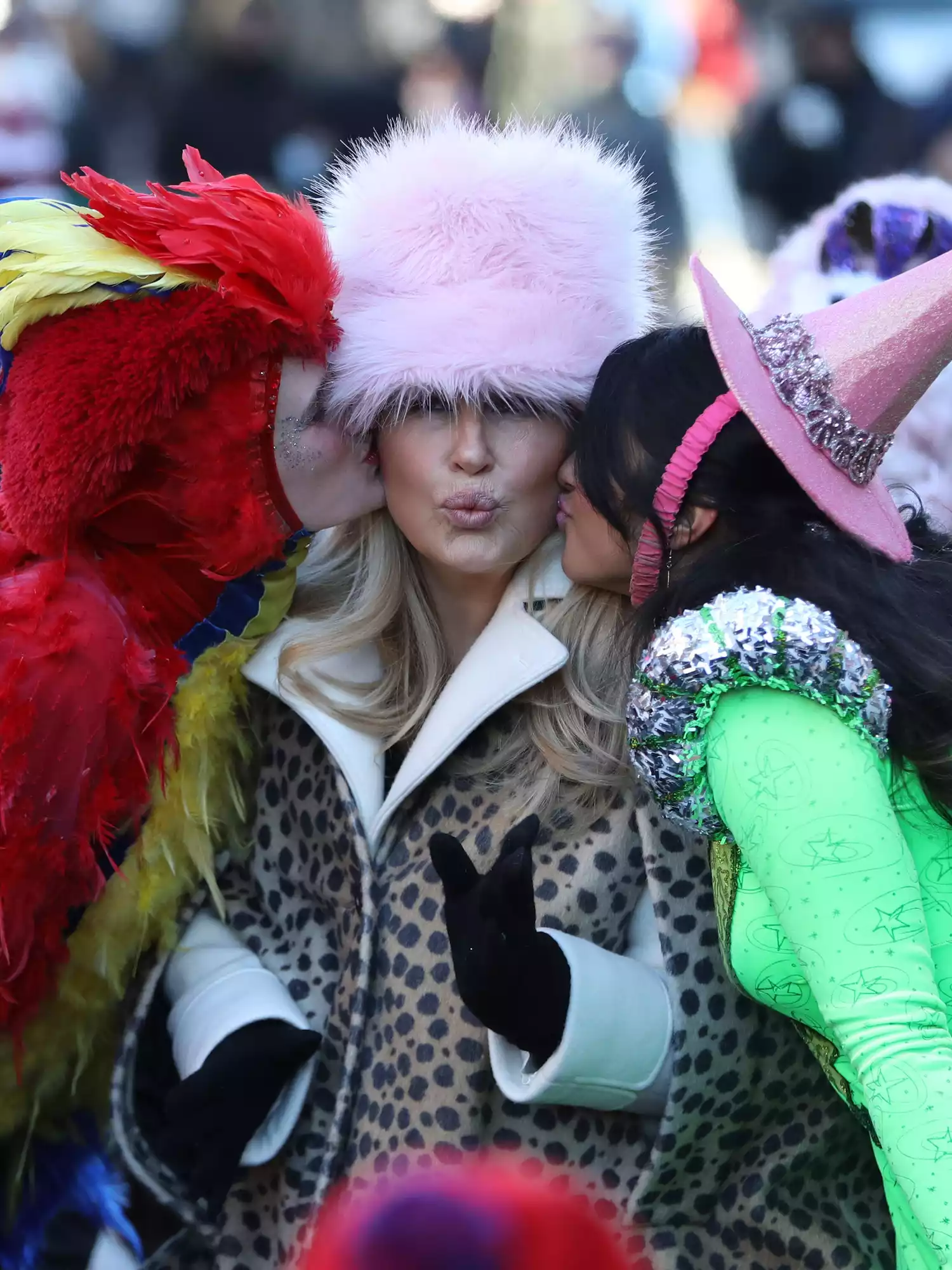 Jennifer Coolidge wears a pink fluffy hat and cheetah print coat to the 2023 Hasty Pudding Theatricals Parade