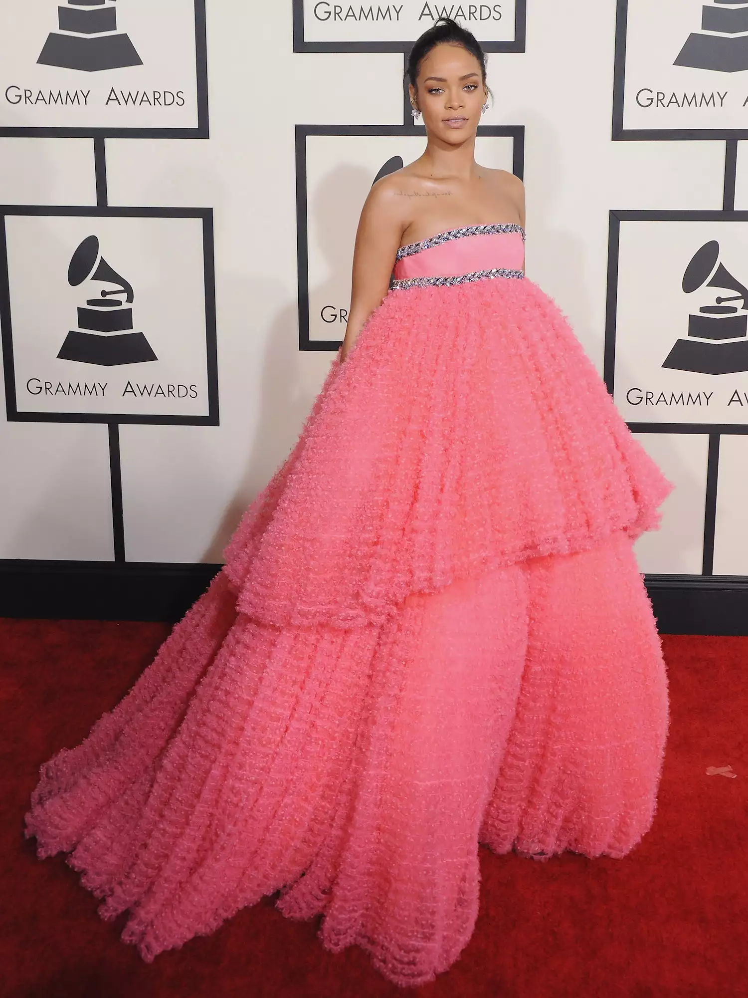 Rihanna wears a pink tulle Giambattista Valli gown and simple updo to the 2015 Grammy awards