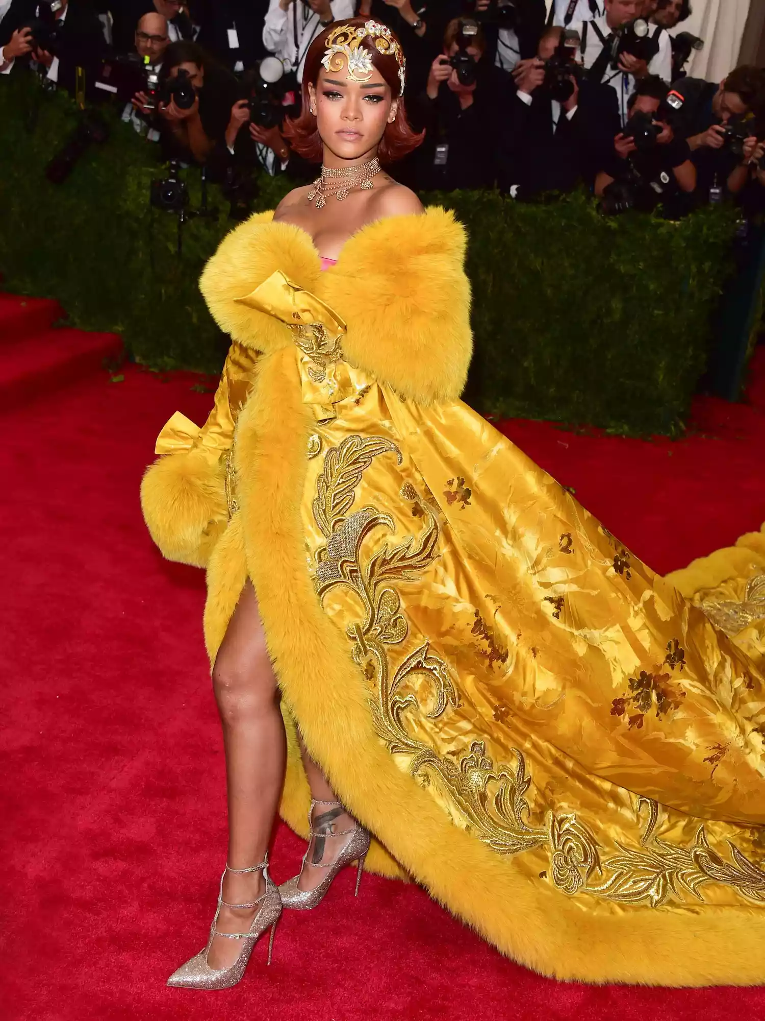 Rihanna wears a yellow Guo Pei gown with embroidery and long train to the 2015 Met Gala