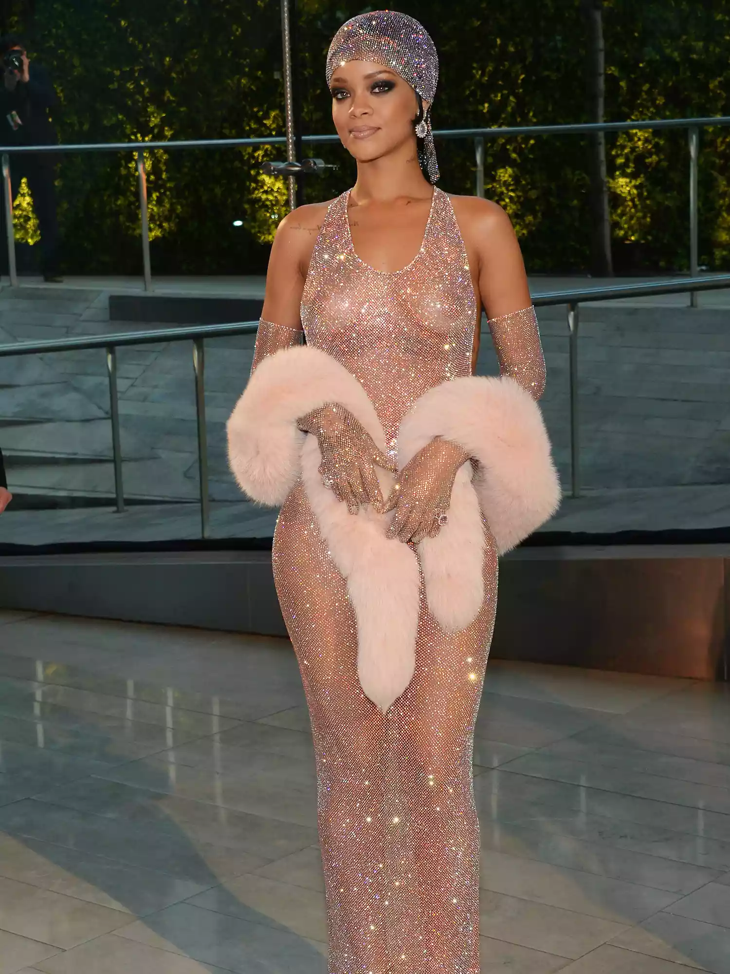 Rihanna wears a sheer Adam Selman gown with Swarovski crystals to the 2014 CFDA Awards