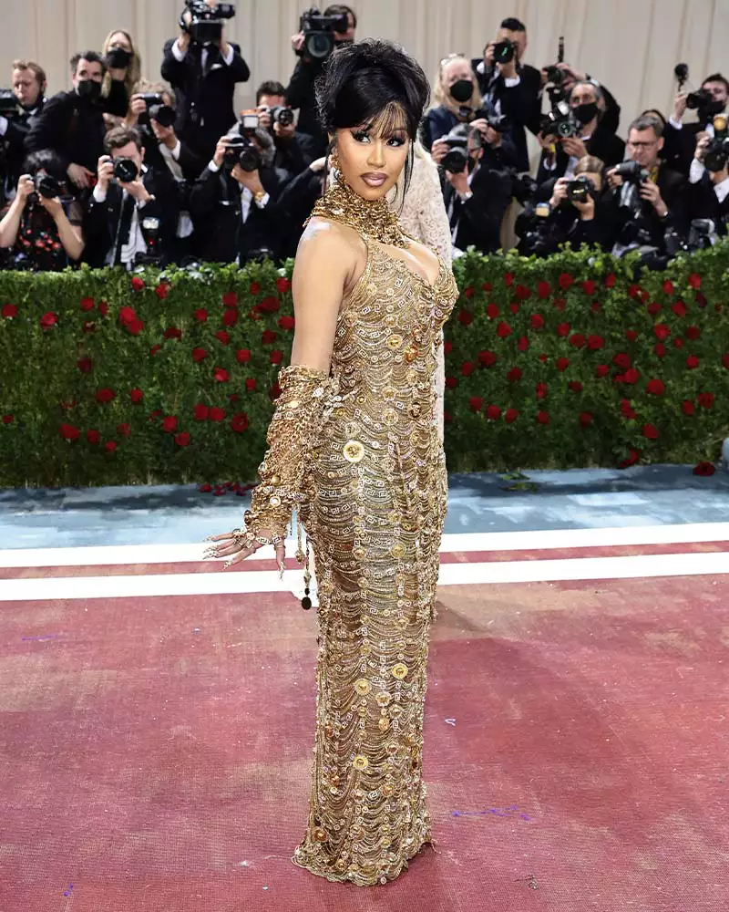 Cardi B wearing a gold Versace gown at the 2022 Met Gala.