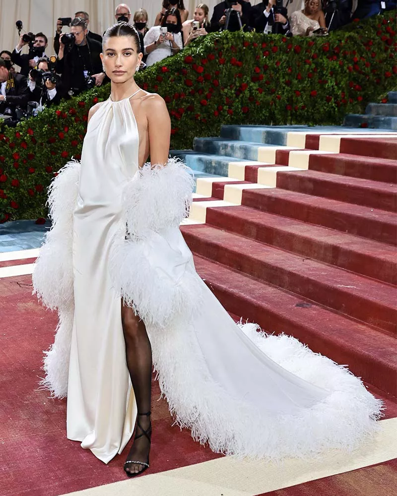 Hailey Bieber wearing a white silk Saint Laurent gown at the 2022 Met Gala.