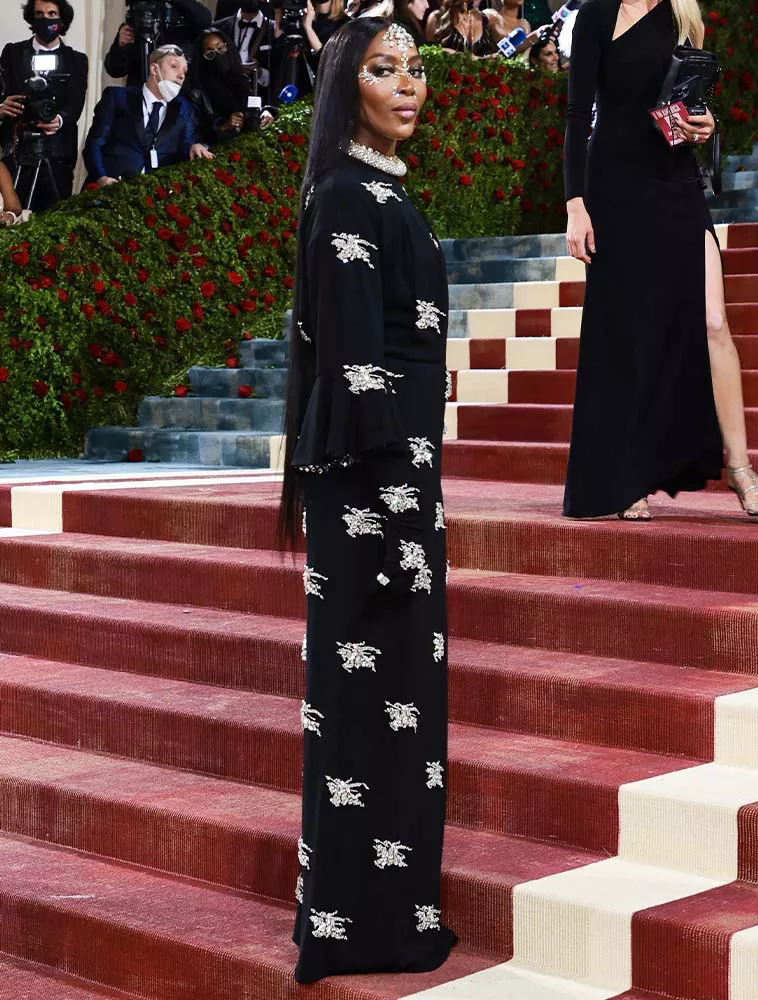 Naomi Campbell wearing a black Burberry gown at the 2022 Met Gala.