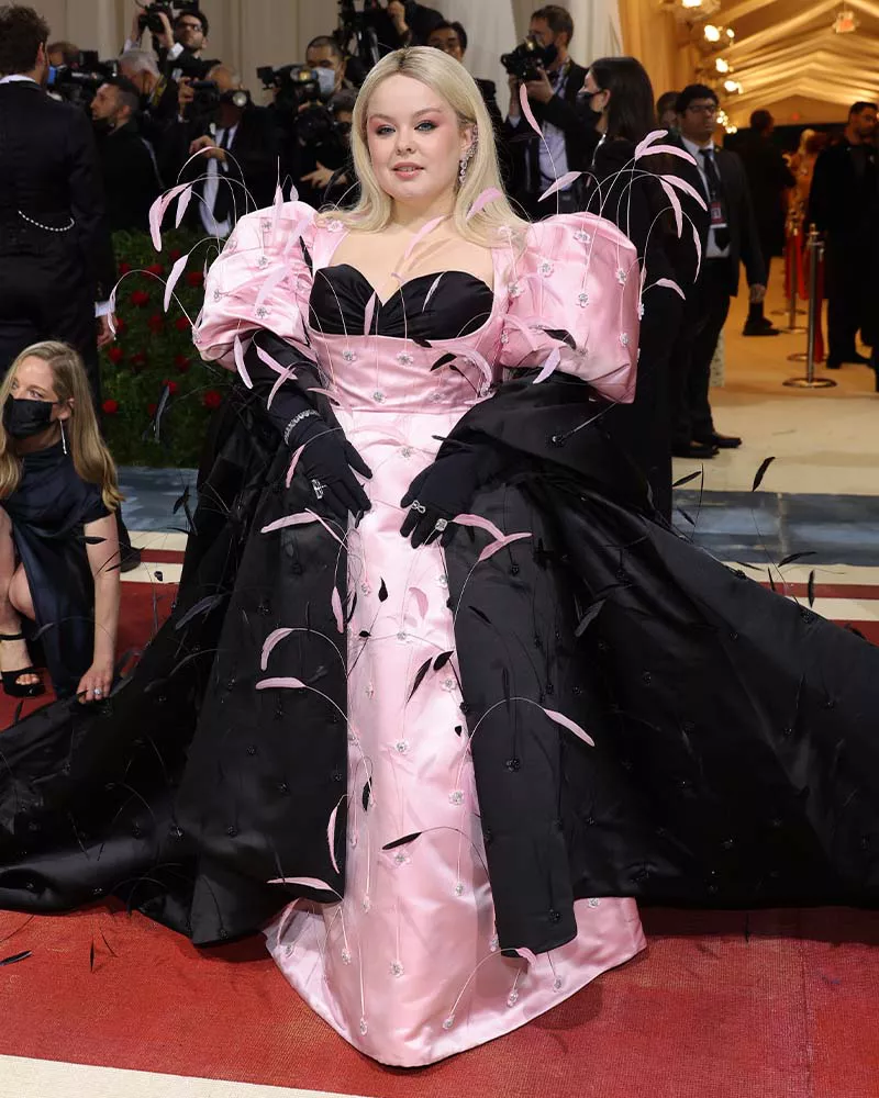 Nicola Coughlan wearing a feathered black-and-pink gown at the 2022 Met Gala.