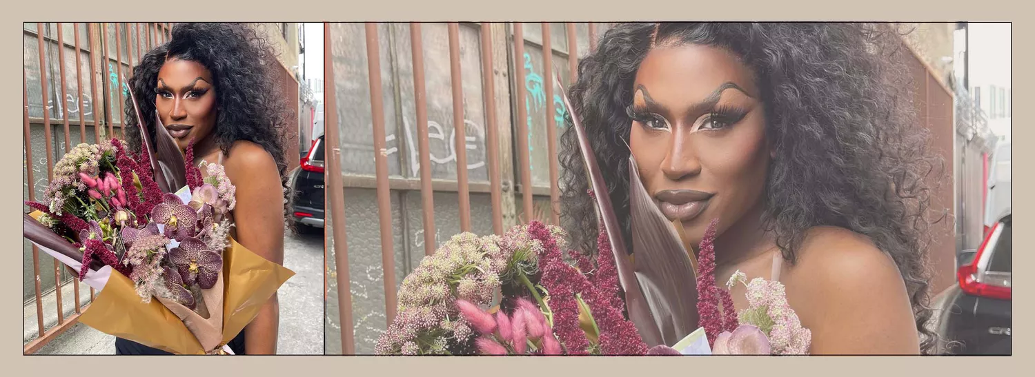 Shea Coulee holding a bouquet of flowers.