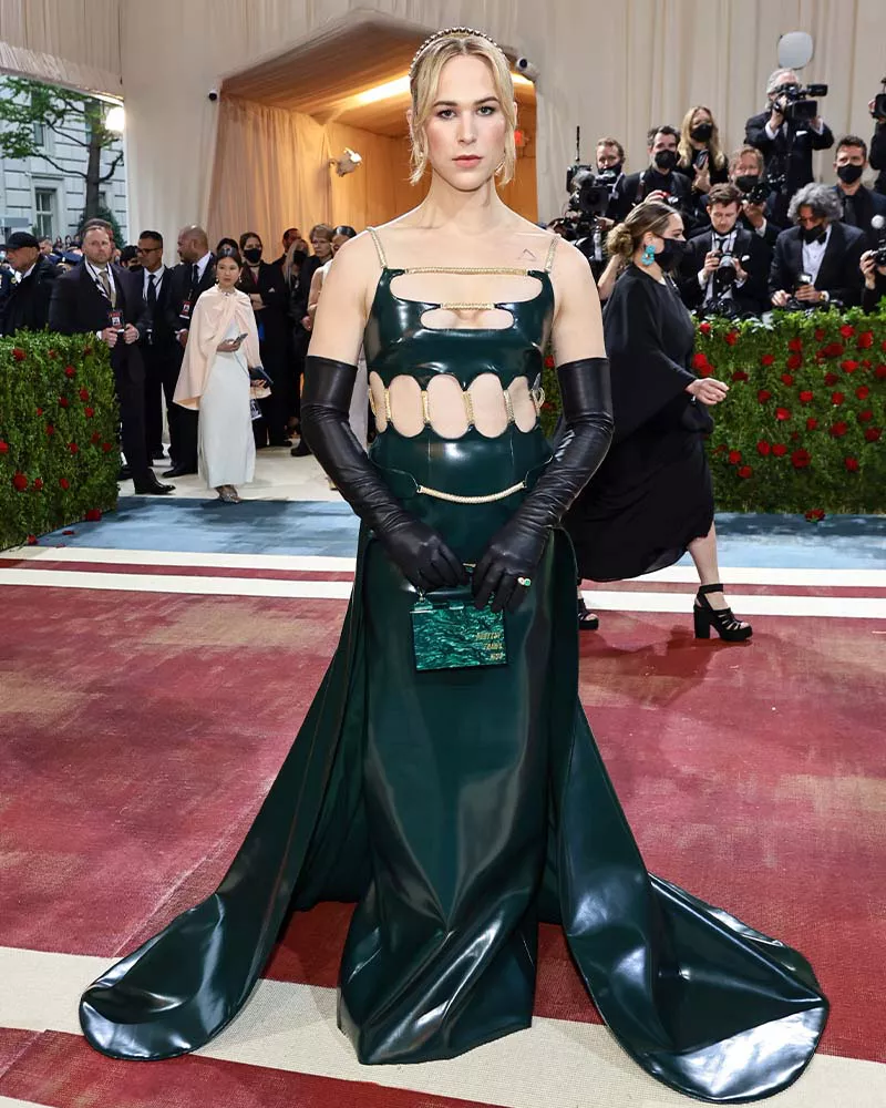 Tommy Dorfman wearing a green leather Christopher Kane gown at the 2022 Met Gala.