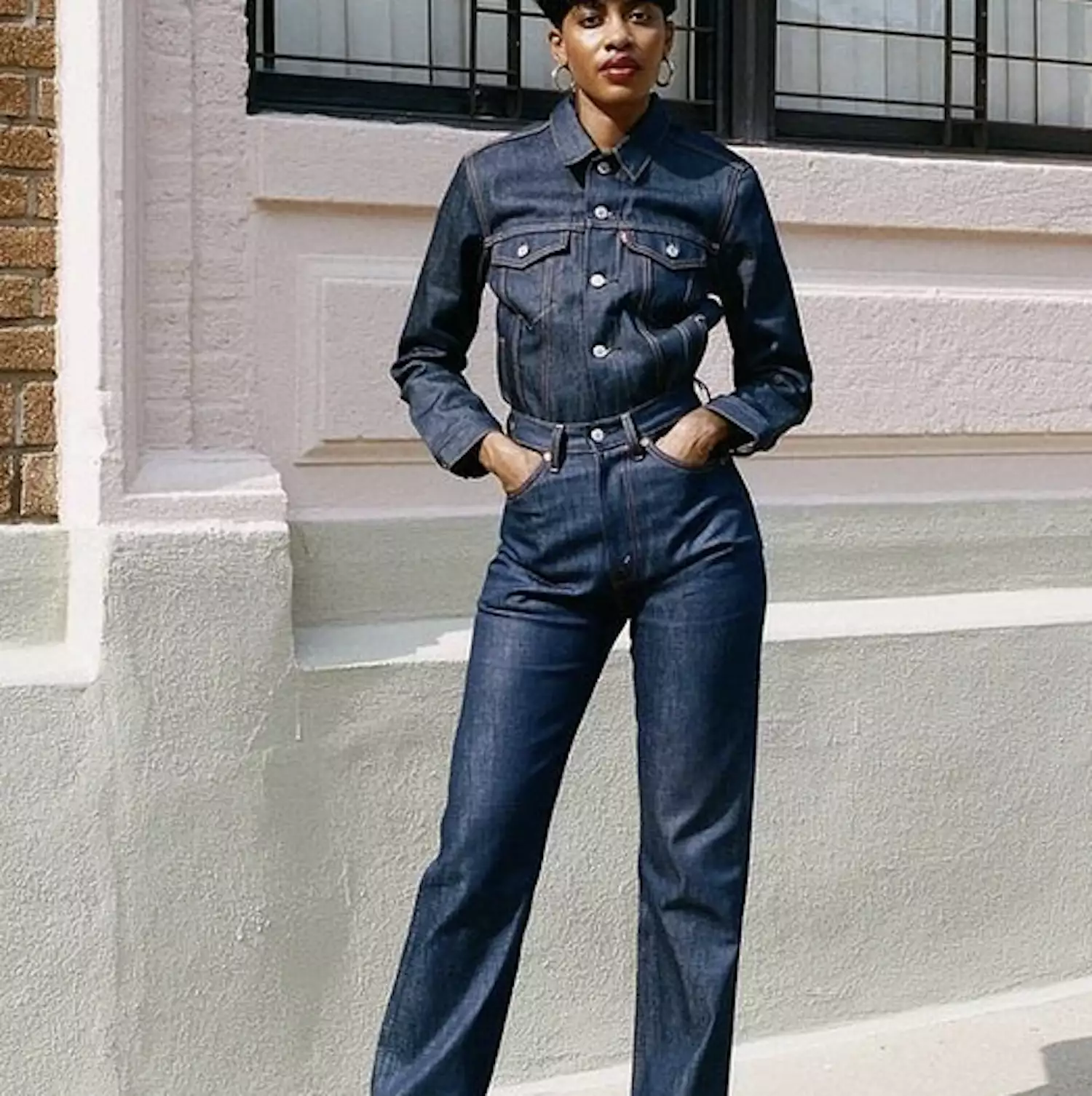 woman in denim jacket and denim jeans