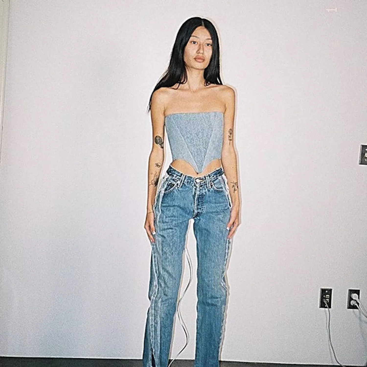 woman in denim corset and jeans