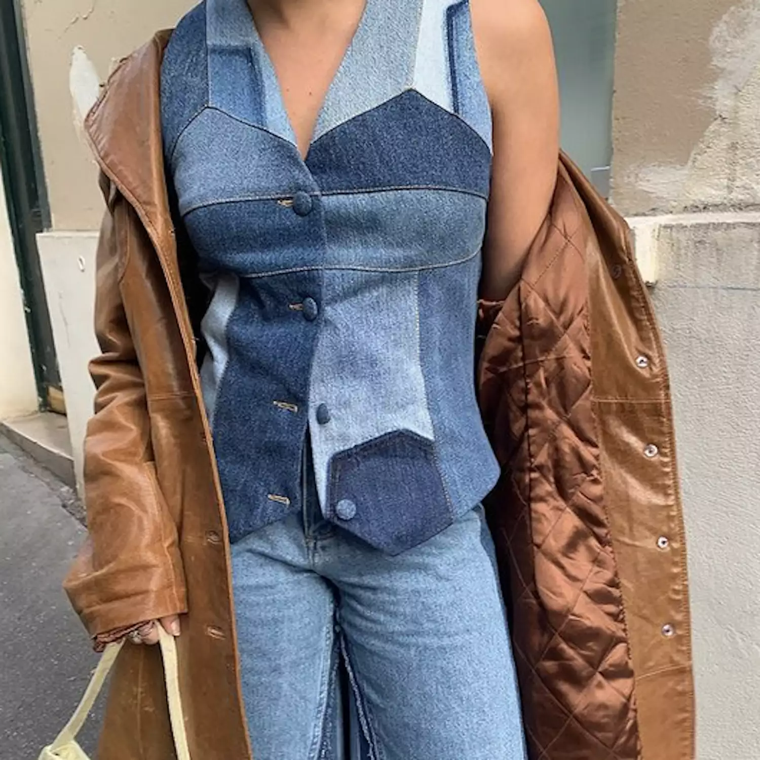 woman in denim vest and jeans