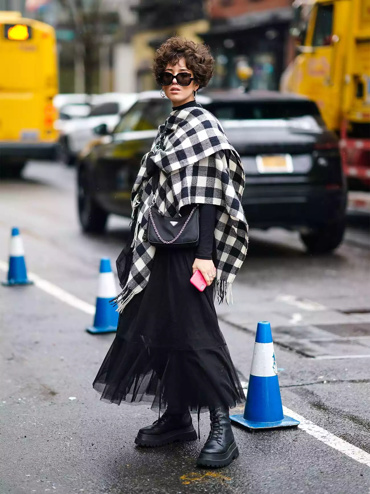 Woman wearing a blanket scarf during NYFW in 2020.