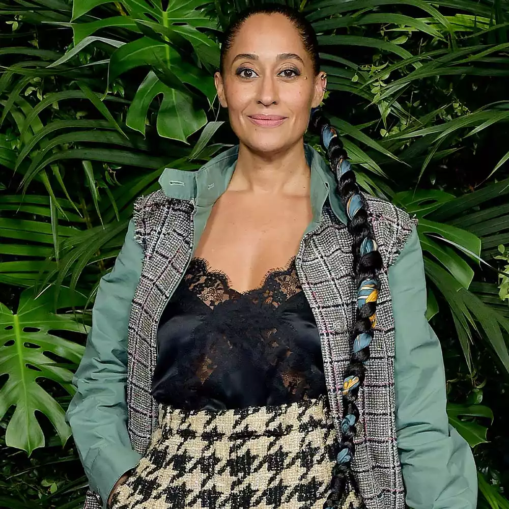 Tracee Ellis Ross wearing a scarf braided in her hair
