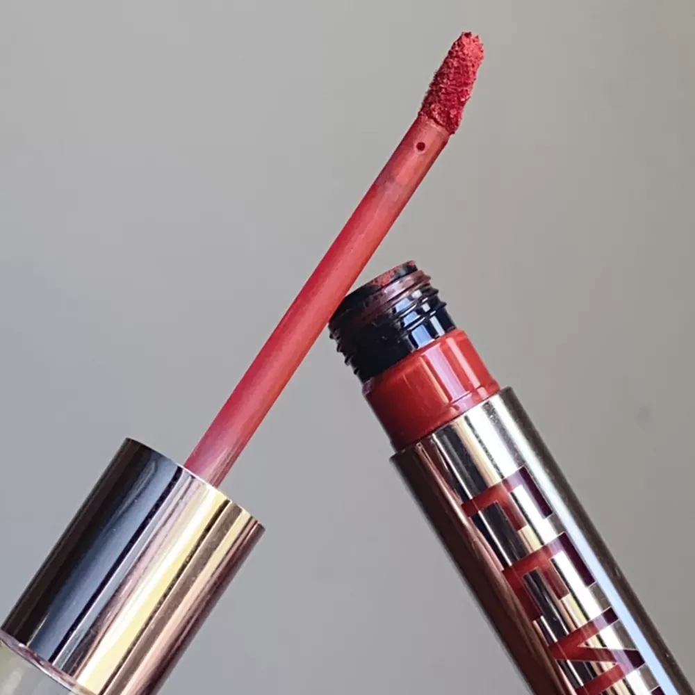Close up of a tube of Fenty's Velvet Icon Liquid Lipstick