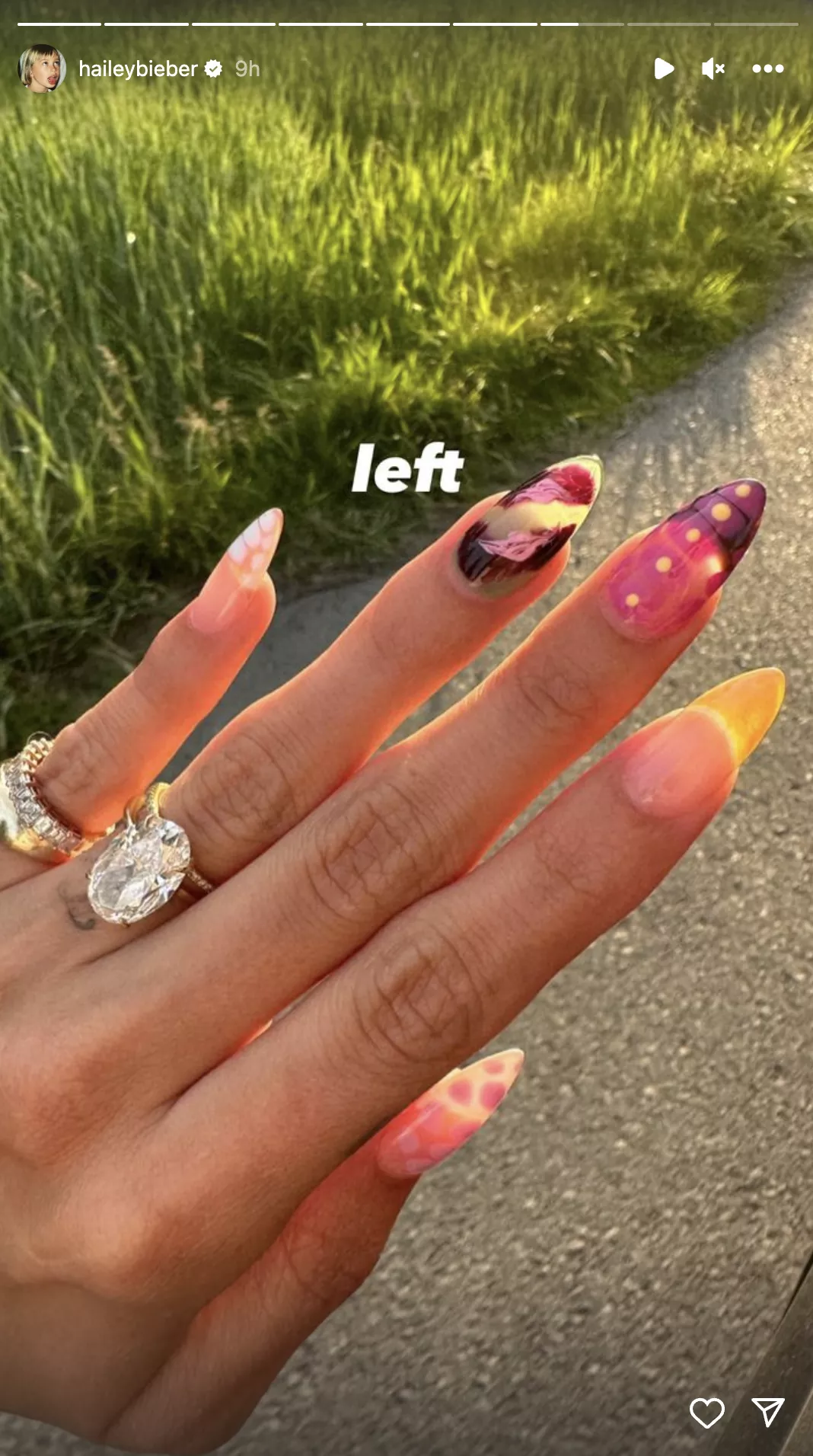hailey bieber's left hand showing the mismatched aura French manicure