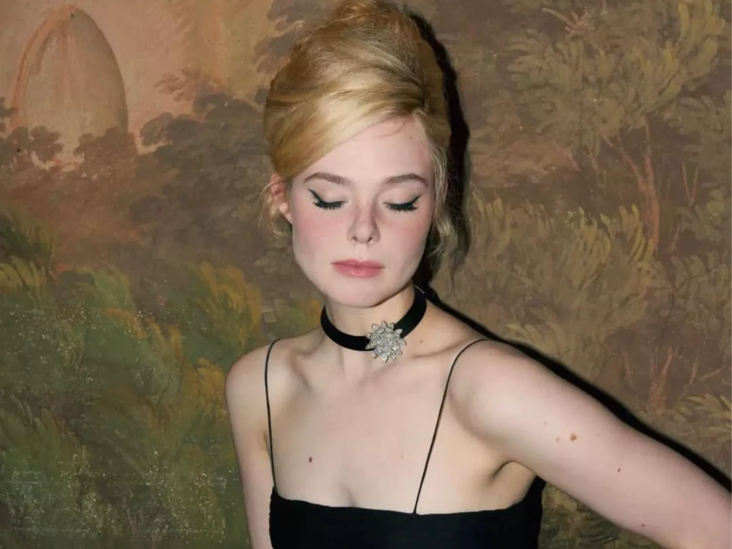 Elle Fanning wearing a baby beehive hairstyle 