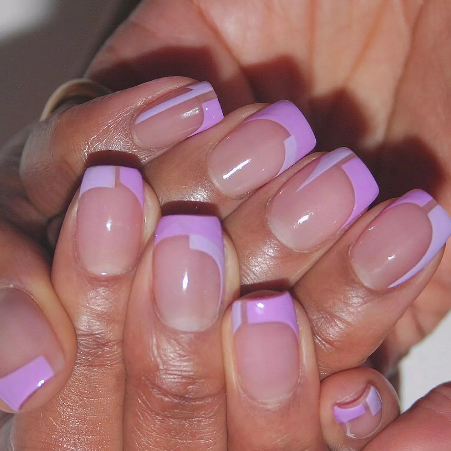 Manicure with lilac and lavender color blocked abstract French tips