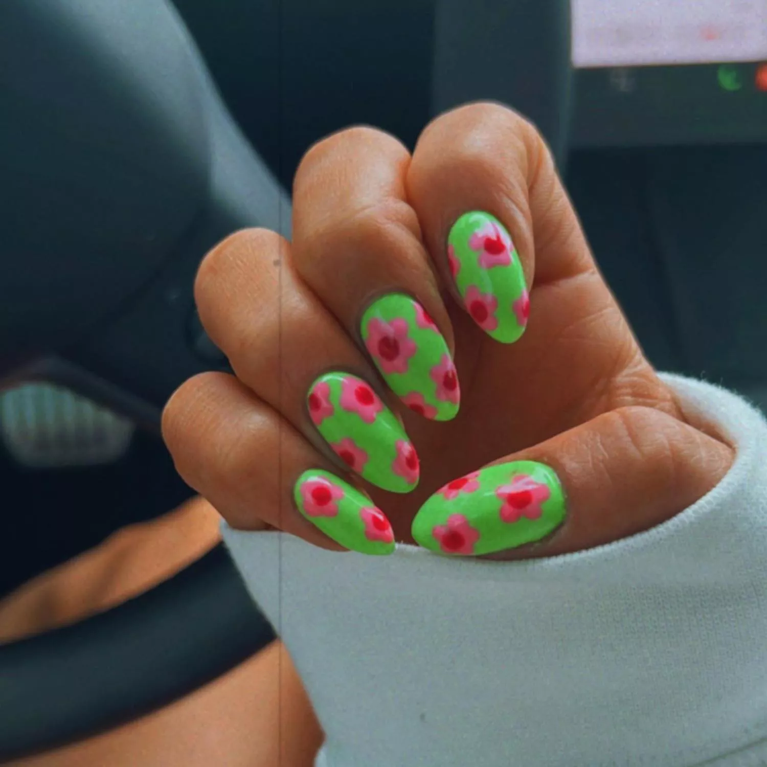 Neon green manicure with watermelon pink daisy nail designs