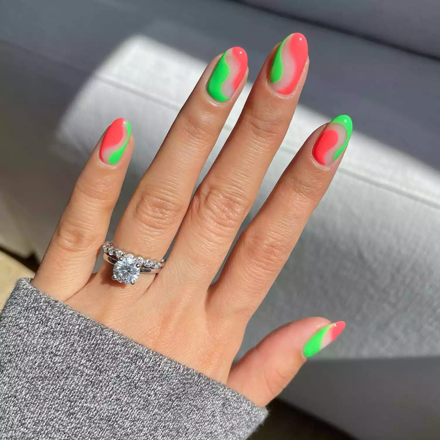 Abstract negative space manicure with watermelon pink and neon green colors