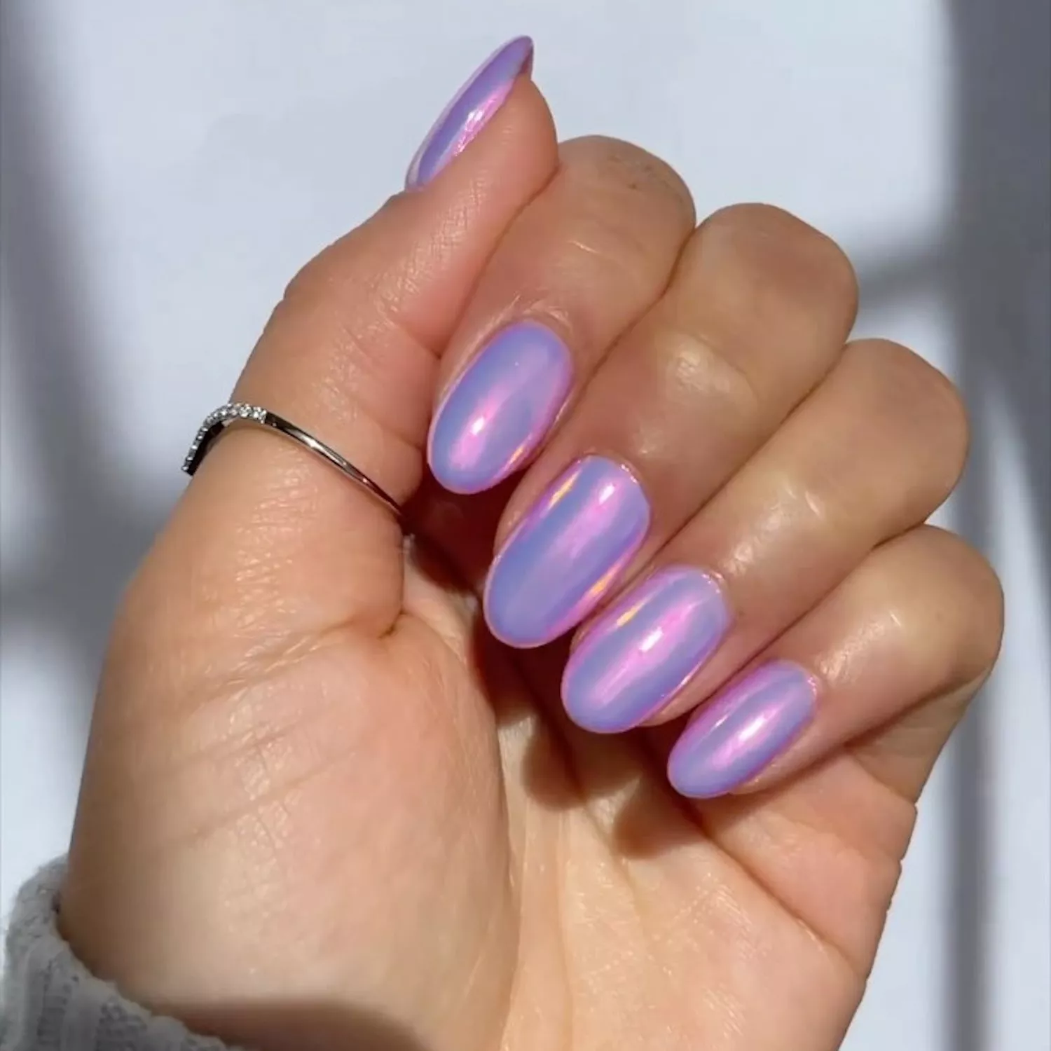 Lavender manicure with chrome iridescent finish