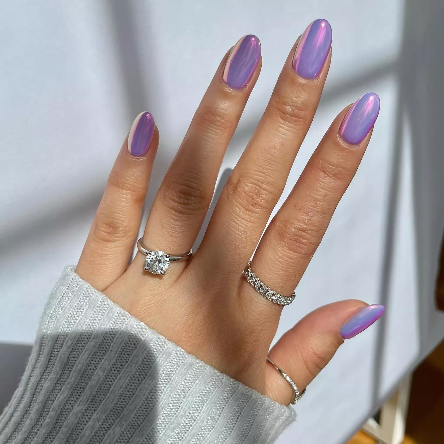 Lavender chrome manicure with hints of pink iridescence