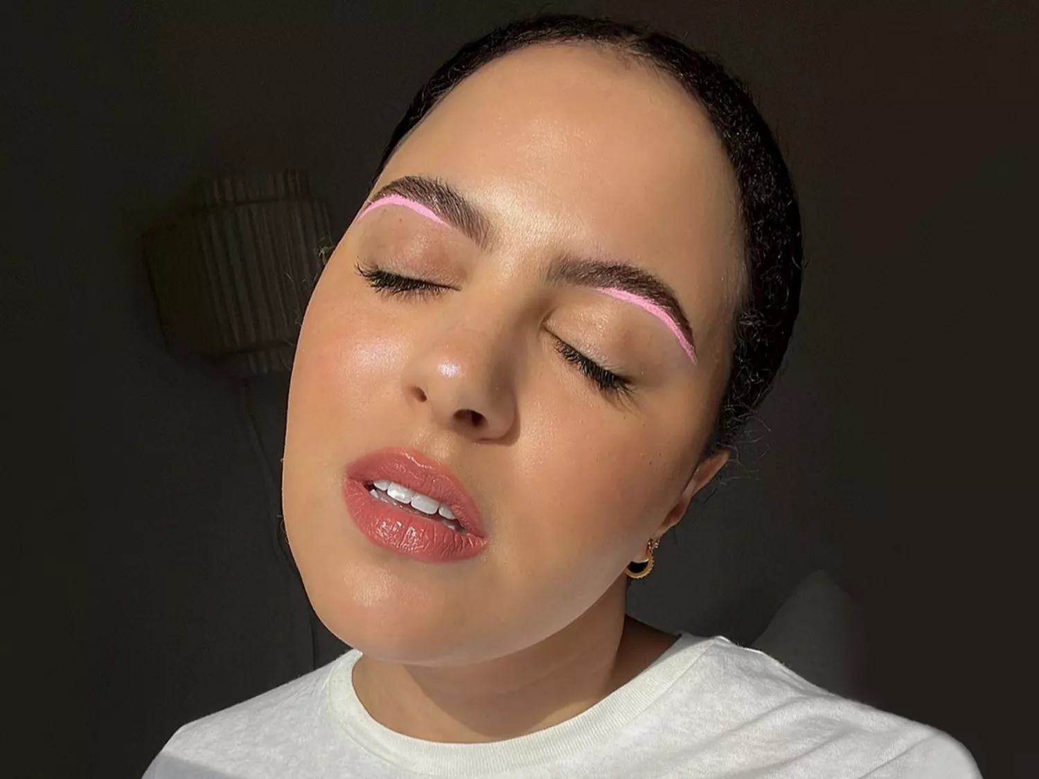 Woman with Light Pink Makeup Under Eyebrows