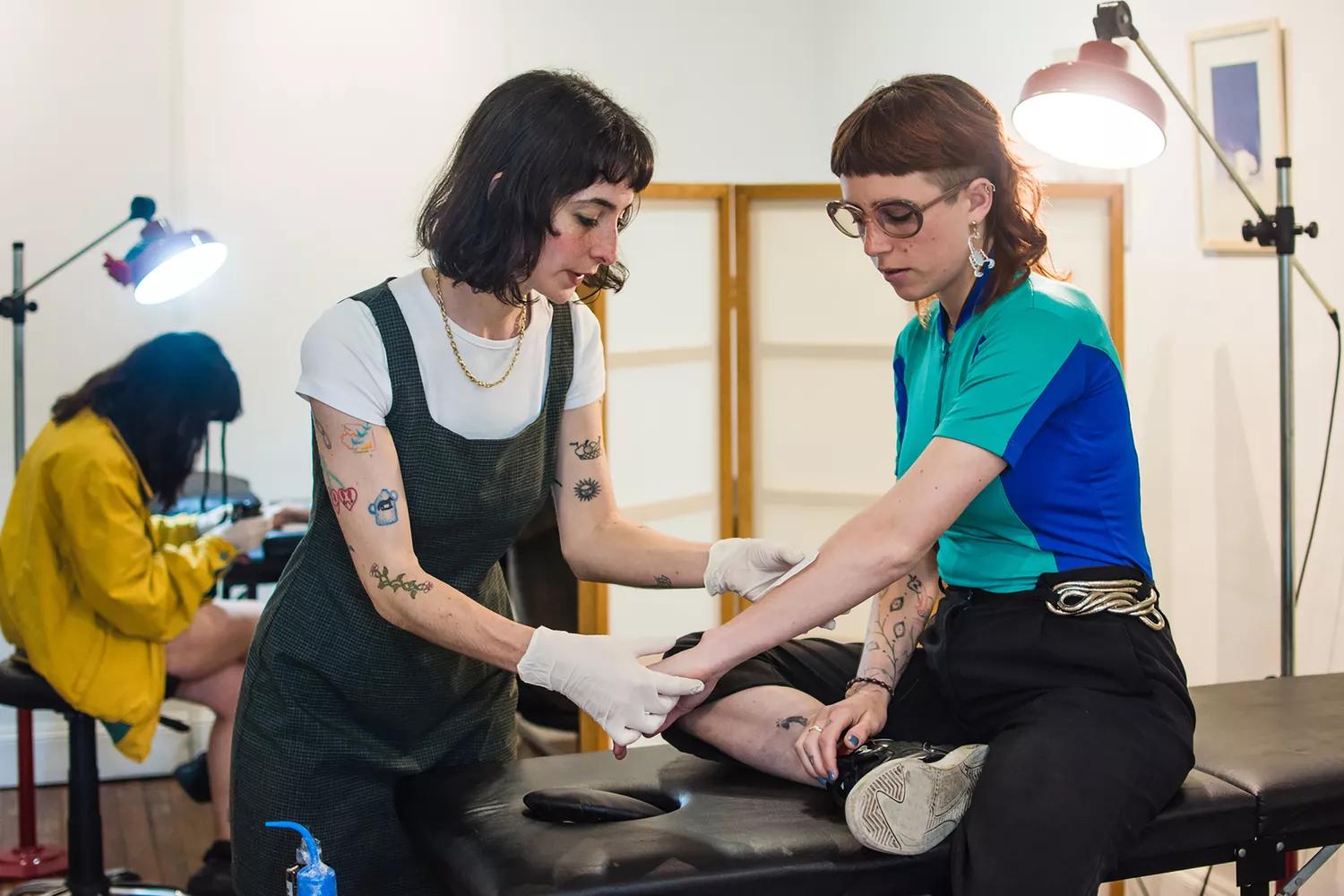 Tattoo Artist Prepping Person for Tattoo