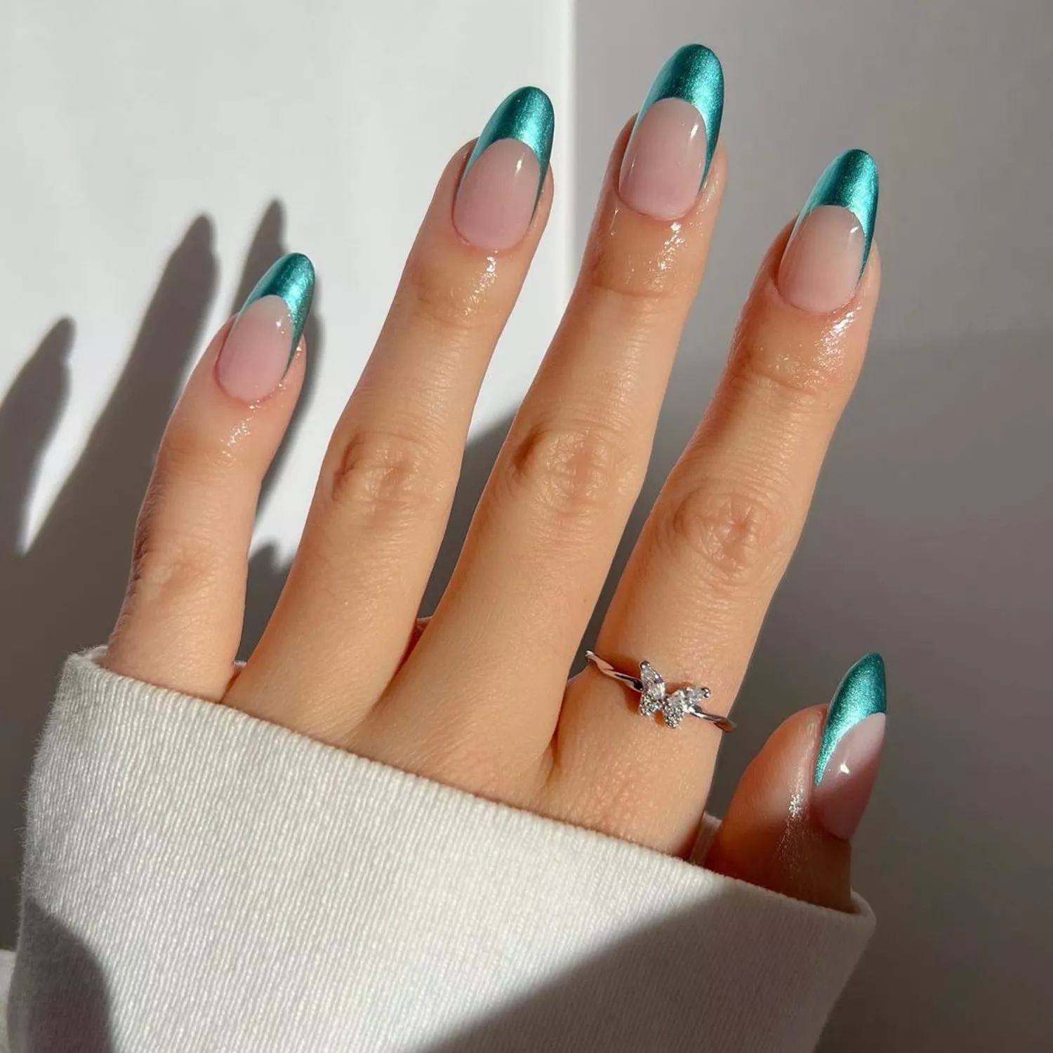 Manicure with mermaid teal metallic French tips