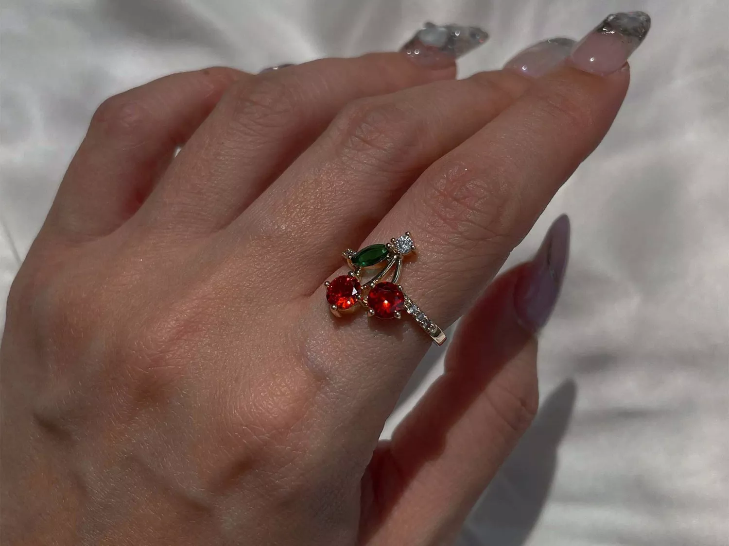 Woman wearing a cherry ring