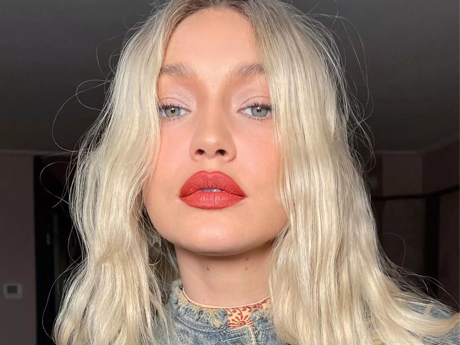 Gigi Hadid wearing red lipstick summer 2023 makeup trend