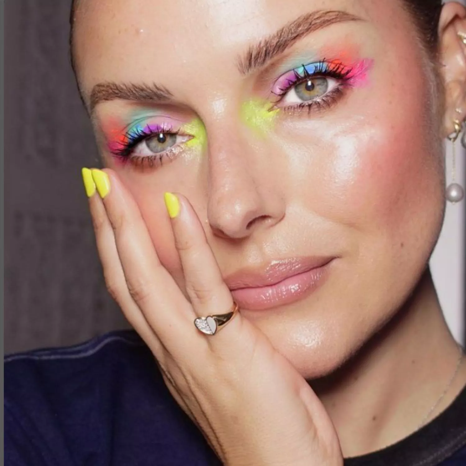 Katie Jane Hughes with neon watercolor splatter paint-style eyeshadow