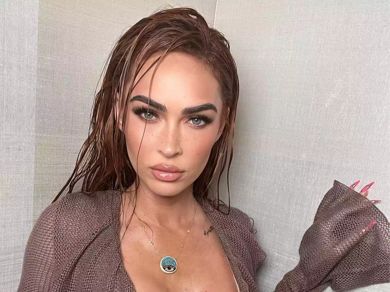 Megan Fox in siren outfit and wet hair
