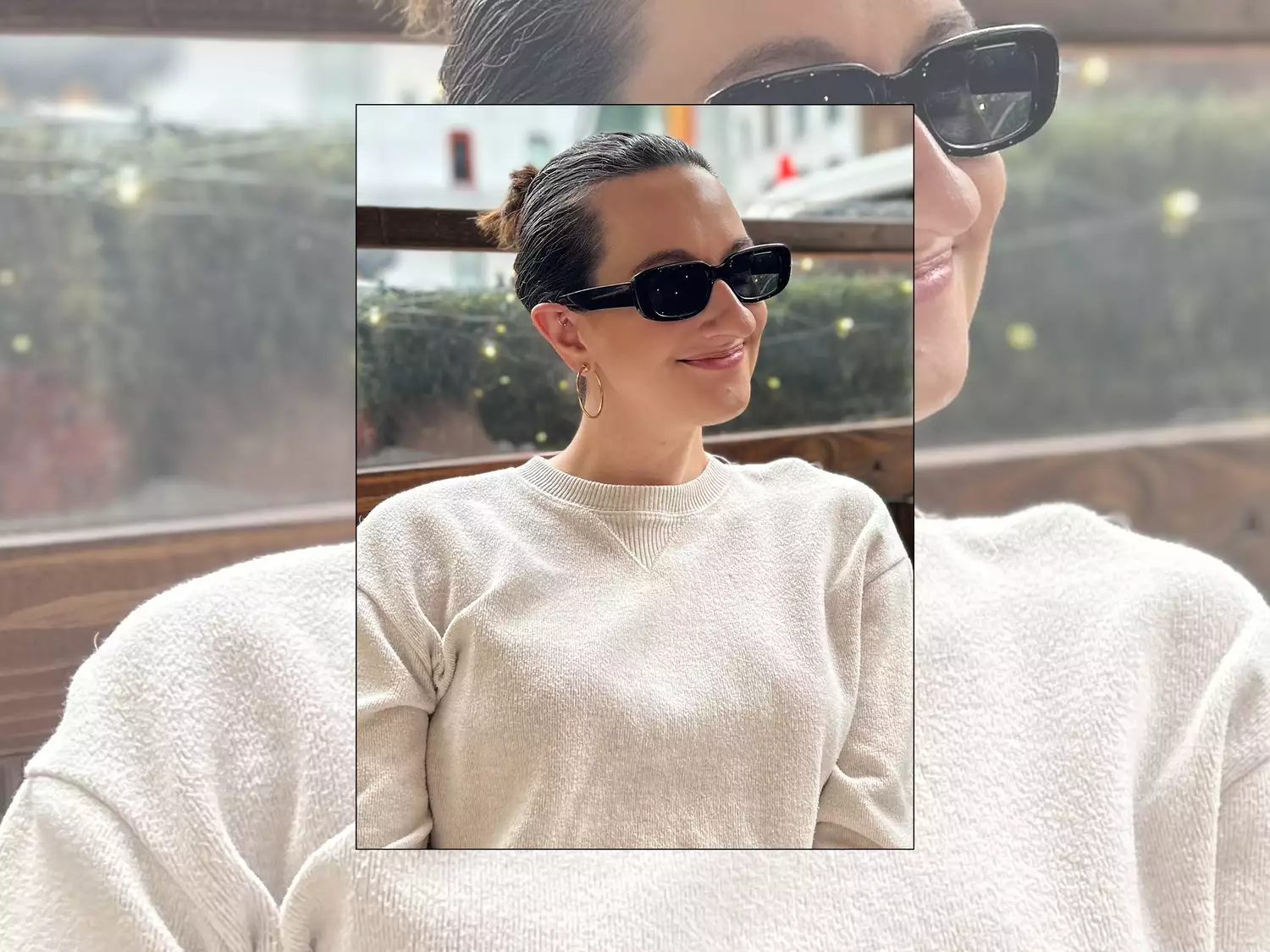 Byrdie editor Erika Harwood wears rectangle sunglasses, hoop earrings, and neutral lips
