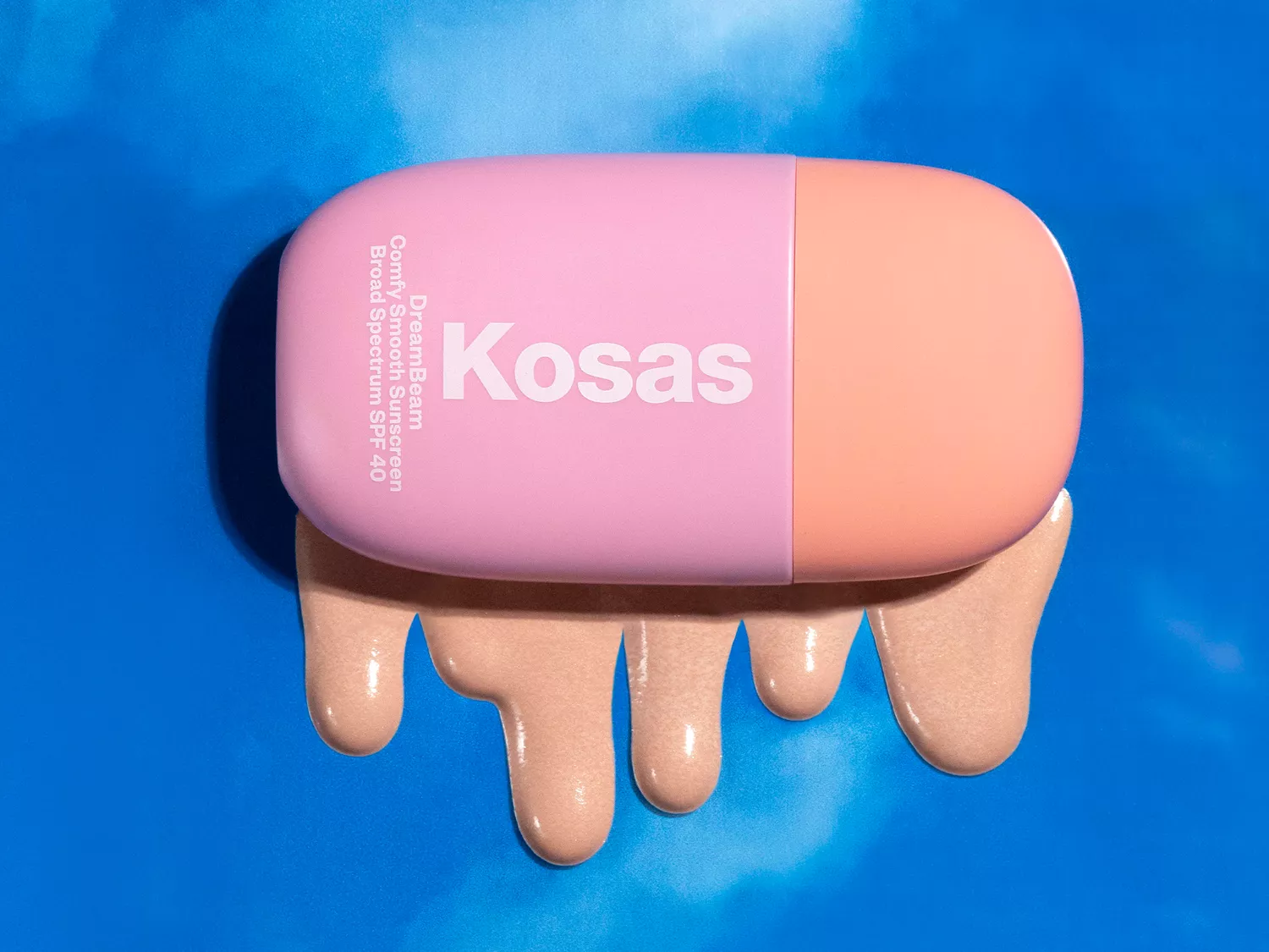 Kosas DreamBeam Sunscreen on a sky background 